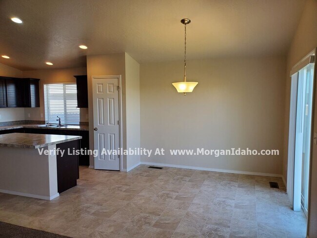 Photo - Office, vaulted ceilings, 2-car garage and...