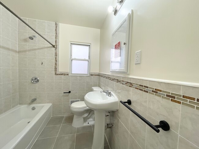 Newly renovated bathroom 1 of 3 - 43-11 172nd Street Unit House
