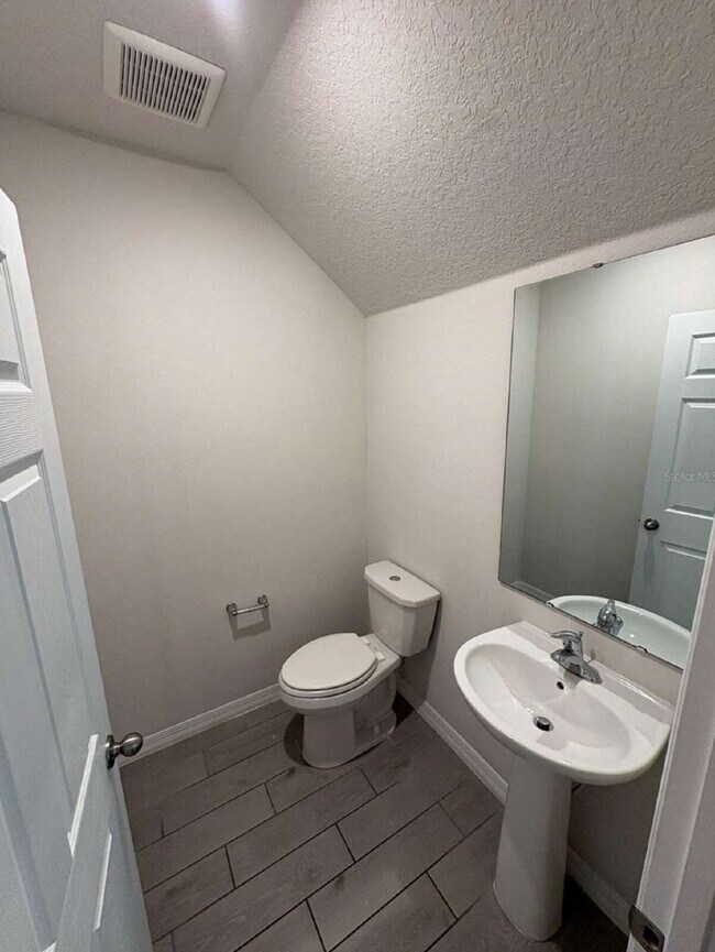 Photo - Stylish 2BR Corner Unit in Ocoee with Attached Garage, Quartz Kitchen & Prime Location Unit Greens at Forest Lake