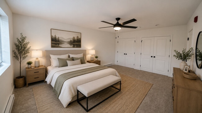 Furnished Master Bedroom with dual closets and ceiling fan