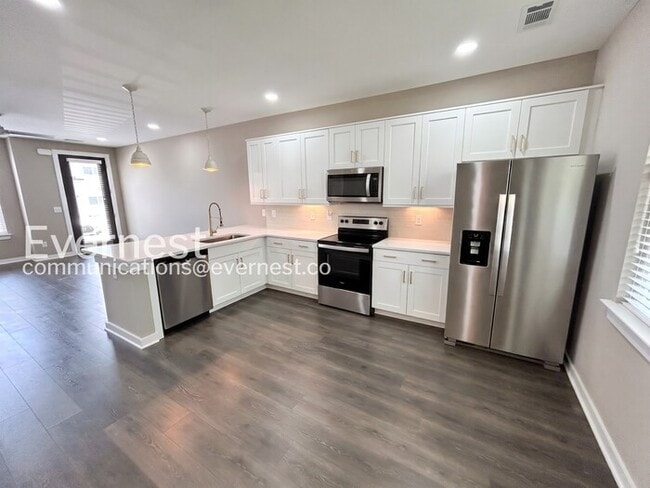 Photo - Limited Time Special Offer / 2 Bed/2.5 Bath Townhome with Off-Street Parking / Pet-Friendly / Ava...