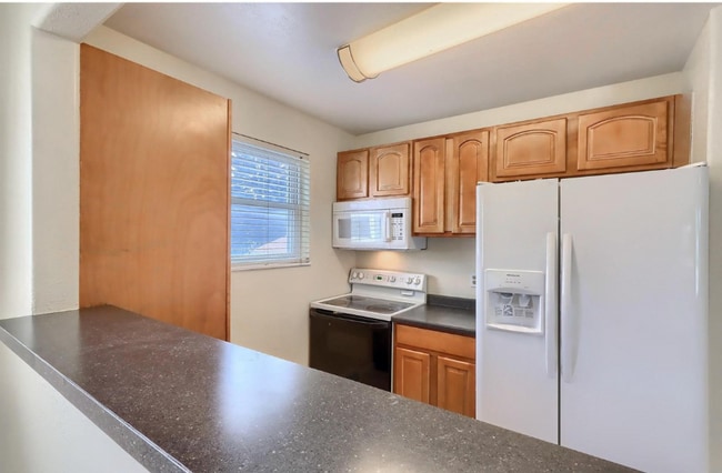 White microwave was replaced with a new black microwave - 4571 S Hannibal St Unit 28