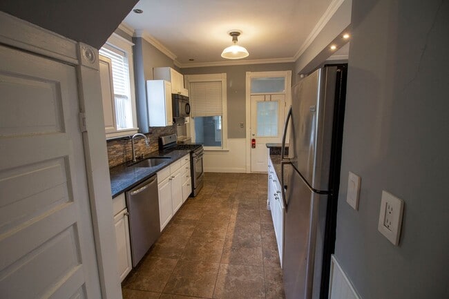Photo - 2 bed/1 bath, Single-family Home! Modern and spacious with off-street parking and a relaxing back...