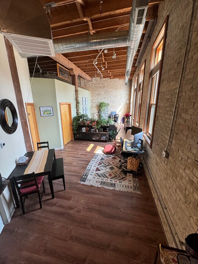 Cream city brick, exposed beams, 18’ ceilings - 306 E Lincoln Ave Condo Unit 306 E Lincoln Ave