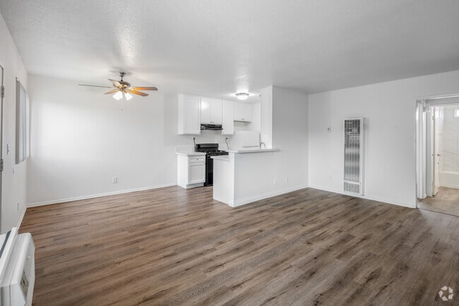 1BR, 1BA - 788SF - Living Room and Dining Room