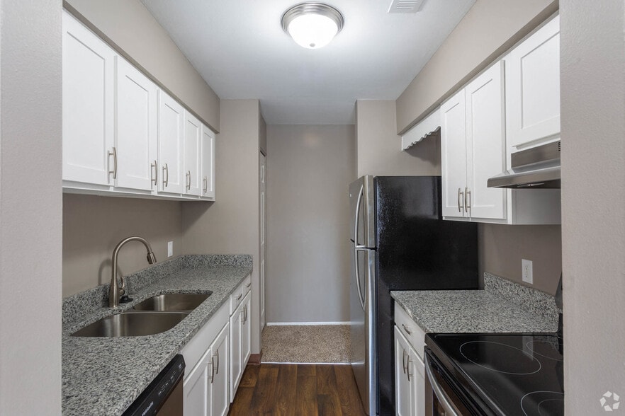 Galley-Style Kitchen With Stainless Appliances