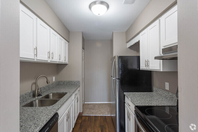 Galley-Style Kitchen With Stainless Appliances - Brighton Glens Rental