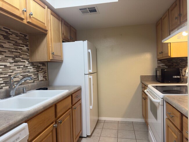 Photo - Sun-Drenched 1-Bedroom Condo in Central Tucson | Gated Community with Pool Unit 131