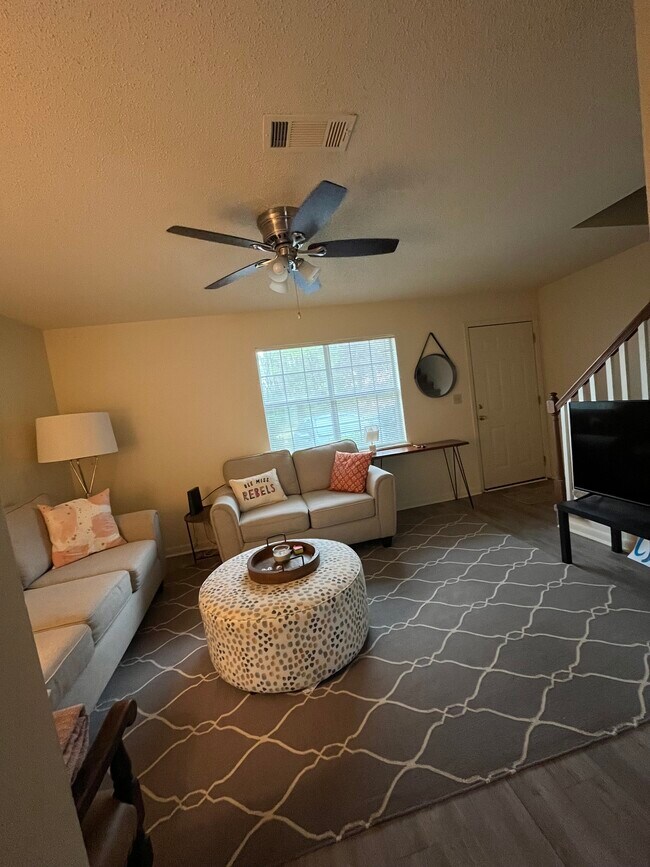 Den, coat closet, ceiling fan, & furniture included
