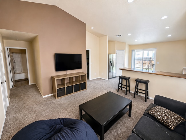Photo - Bright Open-Concept Home with Fenced Yard, Double Garage & Community Amenities