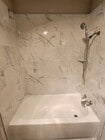 Upgraded tile or solid surface surround options.
