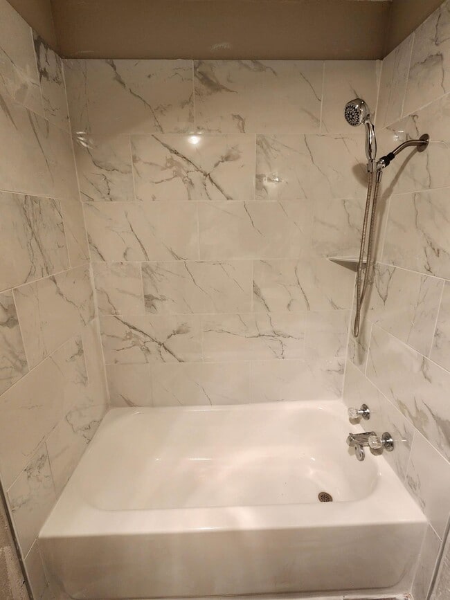 Upgraded tile or solid surface surround options.