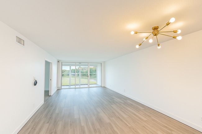 Living and Dining Room + Golf View - 4030 W Palm Aire Dr Unit 407