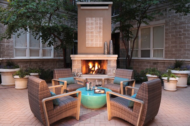 Pool deck equipped with fireplace and ample seating - The Boulevard Apartments