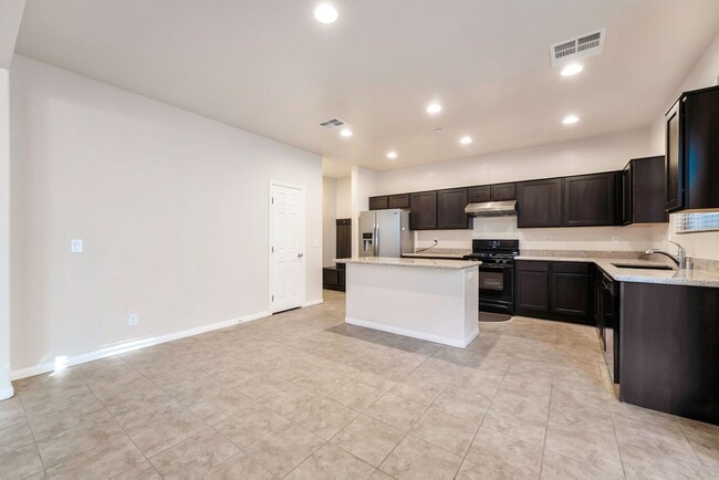 Photo - Stylish Two-Story Retreat with Designer Kitchen, Private Backyard & Flexible Living Space!
