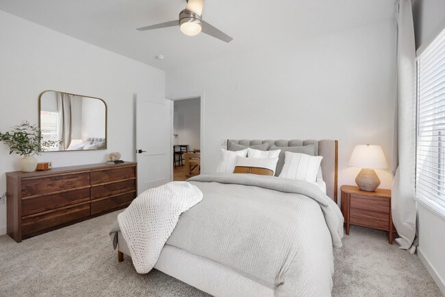 The B2 primary bedroom's vaulted ceiling and oversized windows set it apart from standard Chandler apartments.