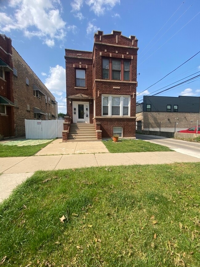 Building Photo - 4816 W Grace St Unit G