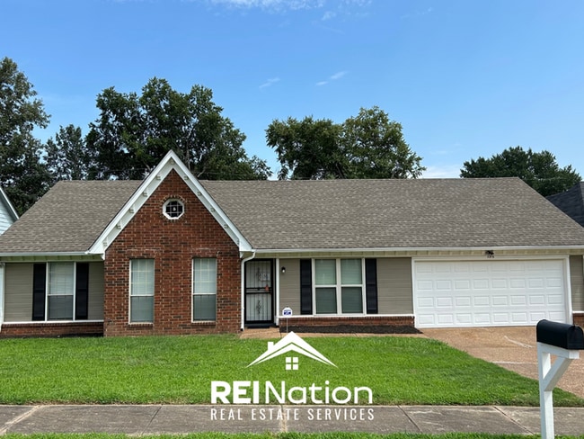 Building Photo - Spacious 4BR/2BA Near Southwind | High Ceilings, Brick Fireplace & 2-Car Garage