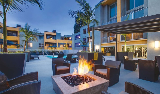 Lounge by the outdoor fireplace - Crescent at West Hollywood Apartments