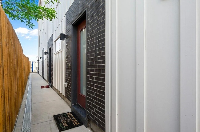 Step into modern elegance with this stylish apartment entrance. - Harley House