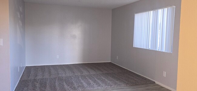 Spacious living room with large window