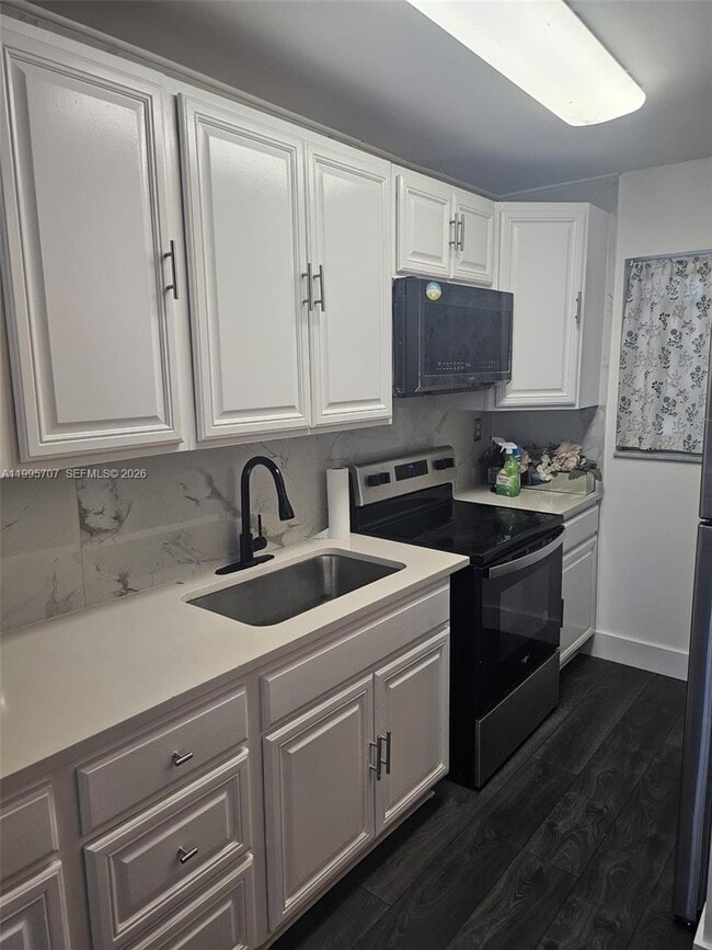 Building Photo - 6055 W 19th Ave Unit 209