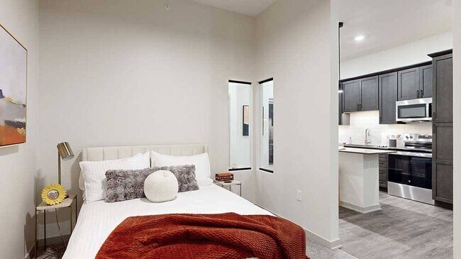 Our Fox studio includes a privacy wall that defines the sleeping area, offering the feel of a separate bedroom within a studio layout.