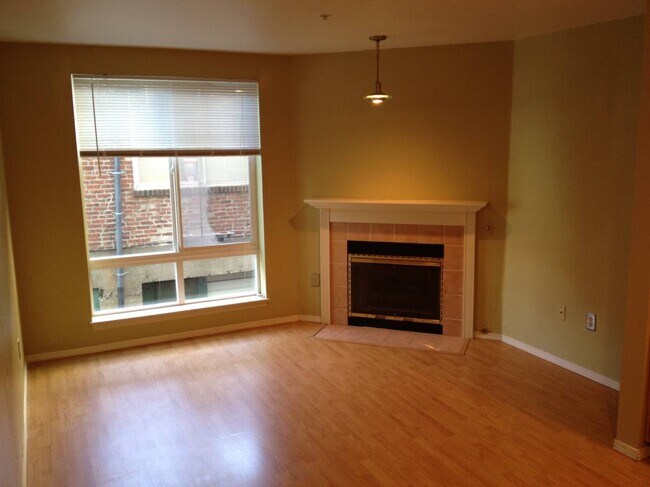 Living room with cozy fireplace - 3028 Western Ave Condo Unit 113