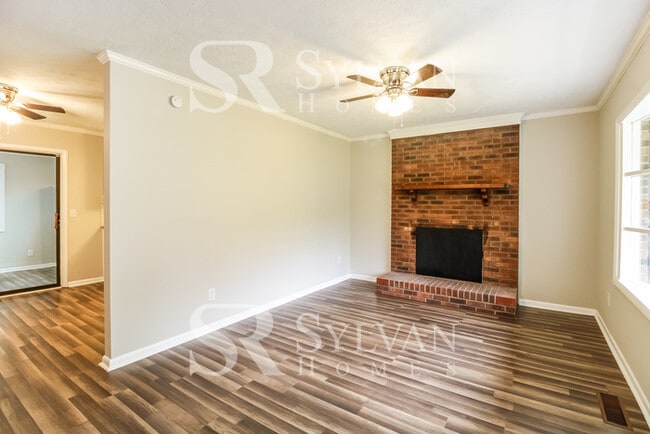 Photo - Enjoy living the good life in this 4 BR, 3 BA brick rancher
