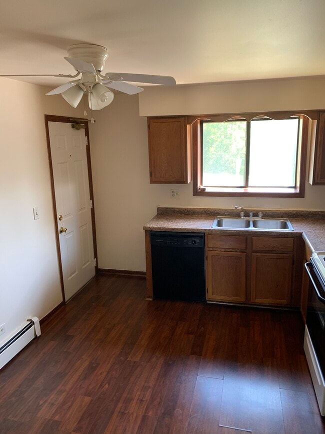Kitchen with wooden floors - 1200 Whispering Hills Ct Unit 1A