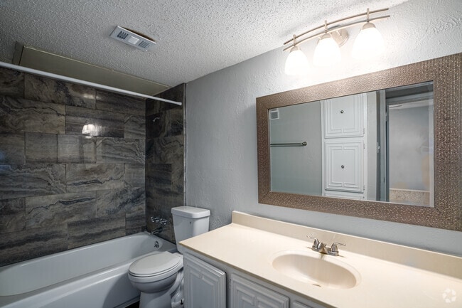 1BR, 1BA - 660SF - Bathroom Modern bathroom with granite-style counters