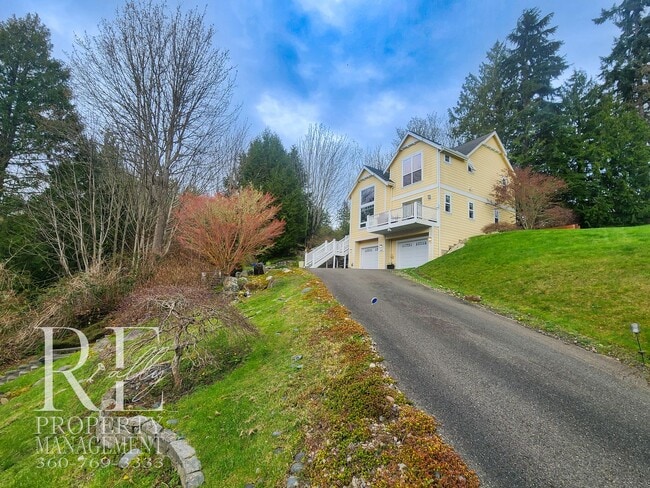 Photo - Light-Filled View Home with Vaulted Ceilings & Warm Wood Finishes