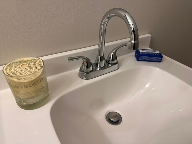 Main-Level Powder Room • Convenient guest bathroom on the first floor. - 55 Providence Ave