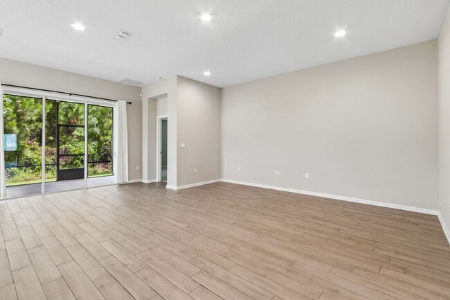 Photo - Modern 4BR Home with 3 Full Baths in River Glen | Screened Porch & Resort-Style Amenities