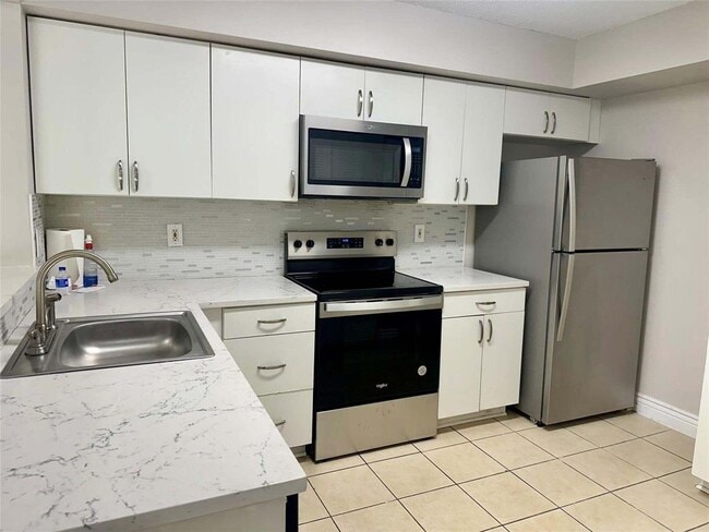 Building Photo - 5701 Riverside Dr Unit 205