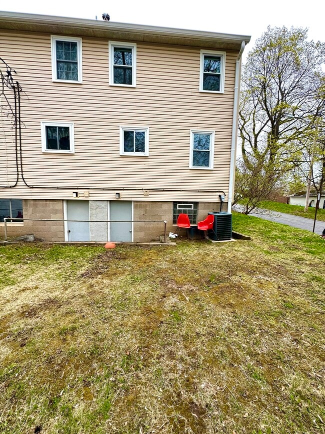 Back yard with walk out access from the lower level - 1082H Mount Hope Ave Unit 47