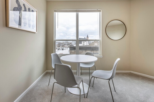 Furnished+ apartment homes include a dining set (Representative Image – exact items and style of furnishings may vary)