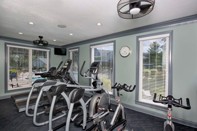 Fitness center with cardio equipment - The Lakes Apartments