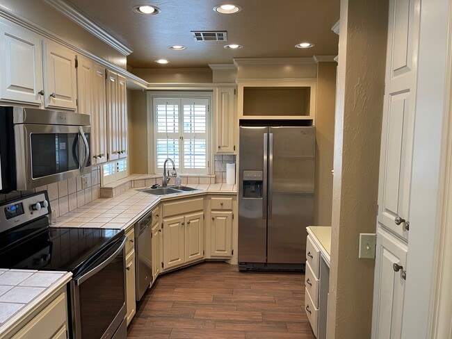 Photo - 55 and up community!!  2 bed flex floorplan with office, bright natural light throughout, 2 car g...