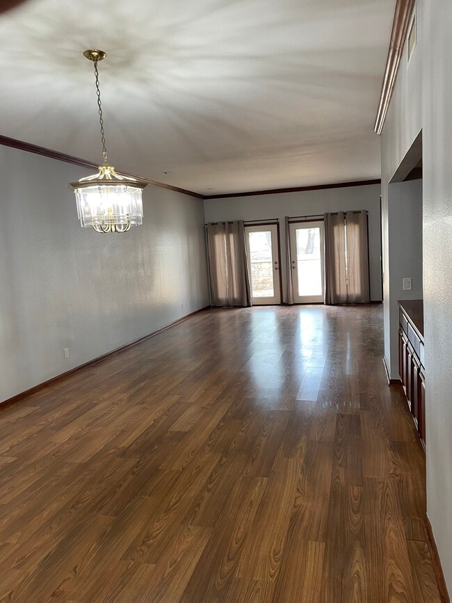 Living room from dining area - 8000 Donore Pl Unit 5