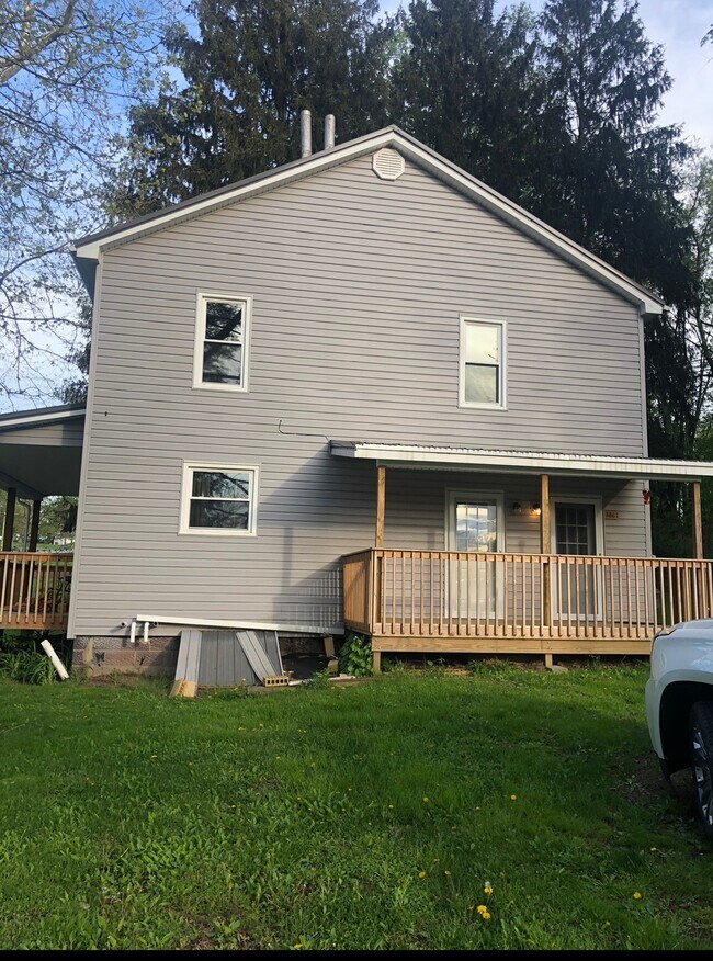 Side entrance for both downstairs and upstairs apartments. Private entrance for both. - 386 Freeport Rd Unit Downstairs Apartment