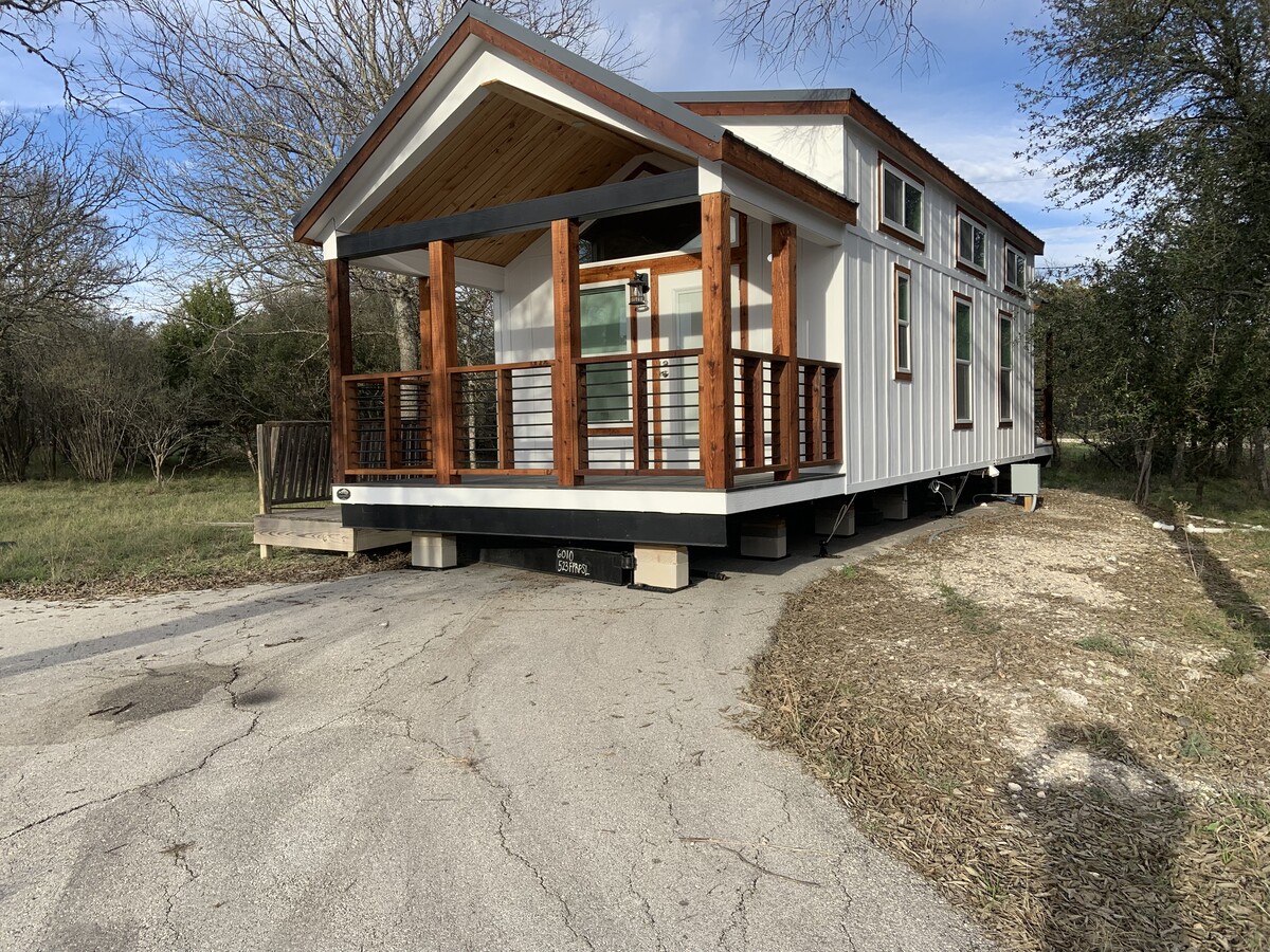 this is initial picture. It has beautiful stone skirting, private deck and patio. Only house on 5 a - 601 Spur 100