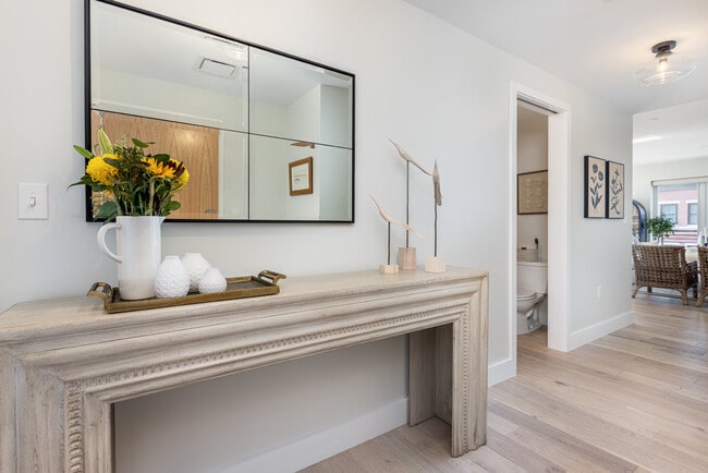 A gracious entry foyer leads to bedrooms on the left and all of the living space on the right. - 383 Commercial St Unit 610