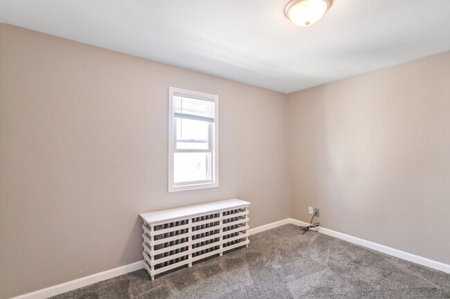 This spacious upper unit features 2 comfortable bedrooms with carpeting