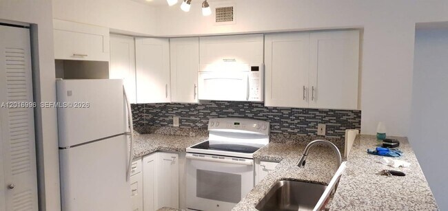 Building Photo - 4560 NW 107th Ave Unit 108-12