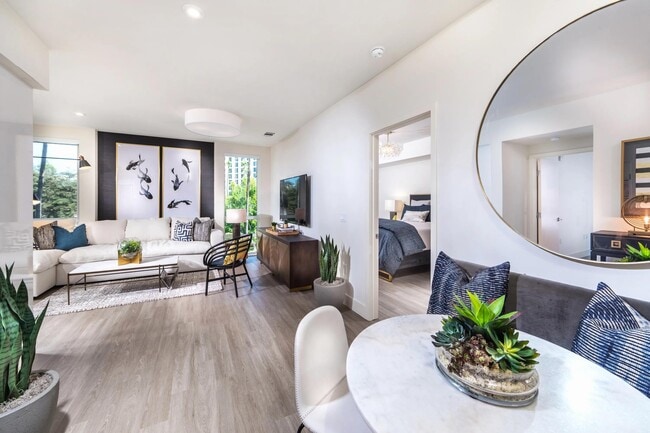 Dining and lounge space offering easy access to the outdoor balcony.