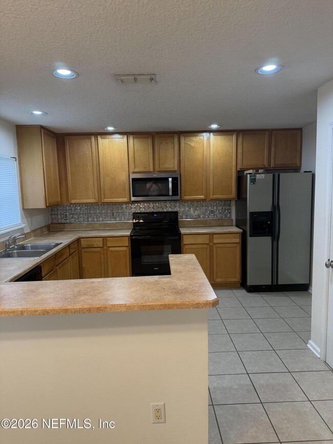 Photo - 1603 Canopy Oaks Dr