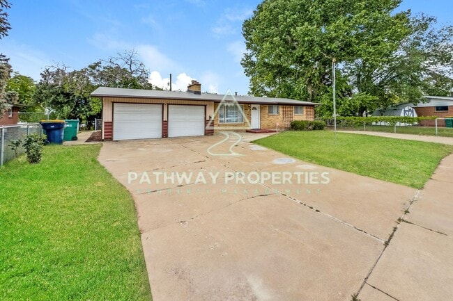 Photo - Charming 3-Bed, 1.5-Bath Brick Home with Spacious Living & Outdoor Retreat in Clearfield, UT!