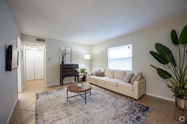 2BR, 2BA - 900SF - Living Room - The Apartments at Oak Creek