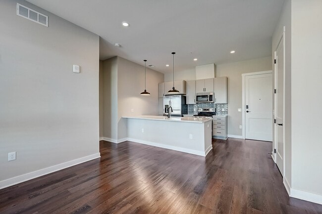 Midpoint Model Living Room to Kitchen